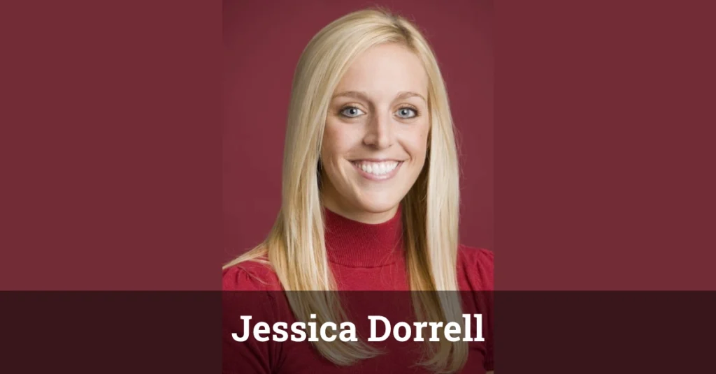 Jessica Dorrell smiling in a professional setting with a blurred background.
