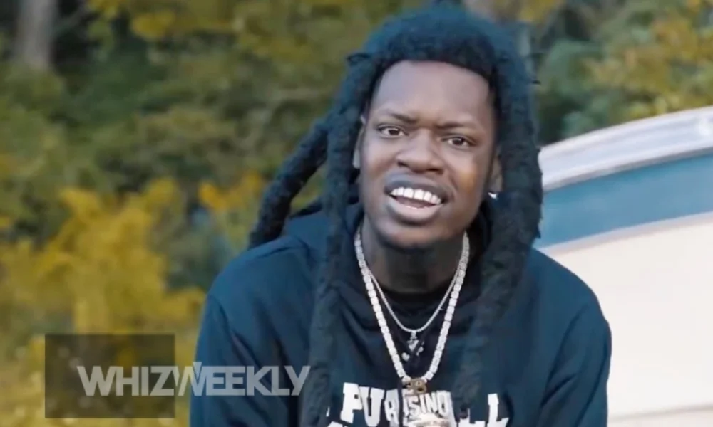 Julio Foolio, a young Florida rapper with a confident demeanor, known for his passion for music and significant impact on the Jacksonville rap scene.