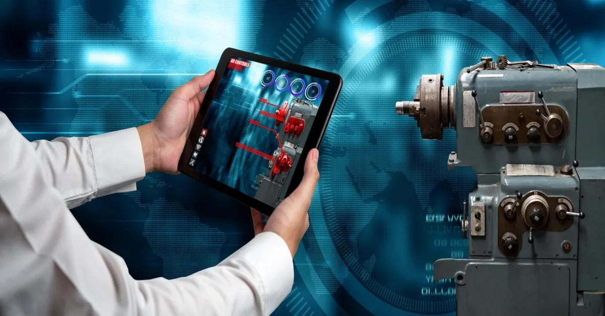 Person using a tablet to access Manguonmienphi's interactive digital learning platform while monitoring industrial equipment in a high-tech environment with futuristic blue interface.