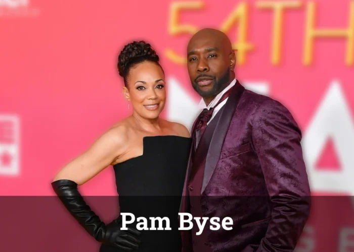 Pam Byse and Morris Chestnut at a formal event, smiling together.
