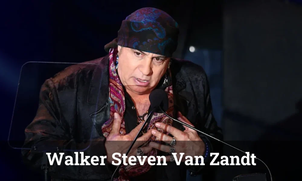 Walker Steven Van Zandt: Biography, Family, Career, and Net Worth Walker Steven Van Zandt performing live on stage with a guitar, wearing a leather jacket under colorful stage lights.