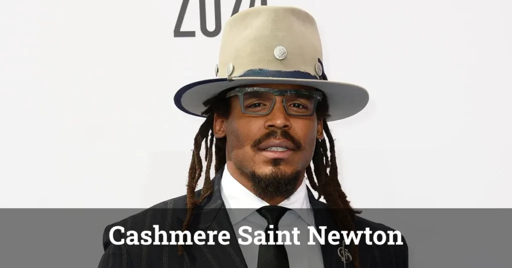 Cashmere Saint Newton posing confidently in a stylish outfit with a well-lit background.