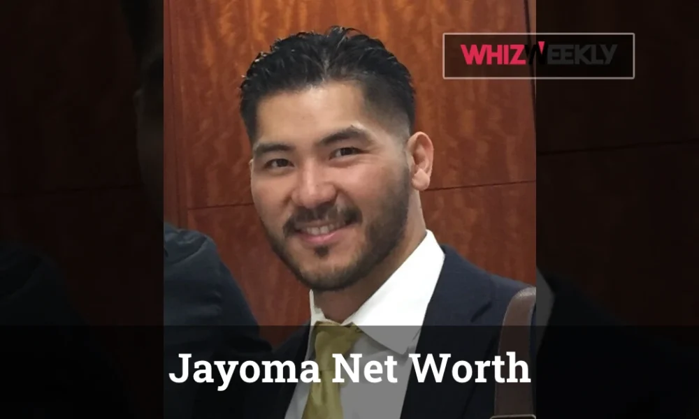 Jayoma Net Worth 2025 - Alain Jayoma in designer suit reviewing case files that contributed to his $600 million fortune.