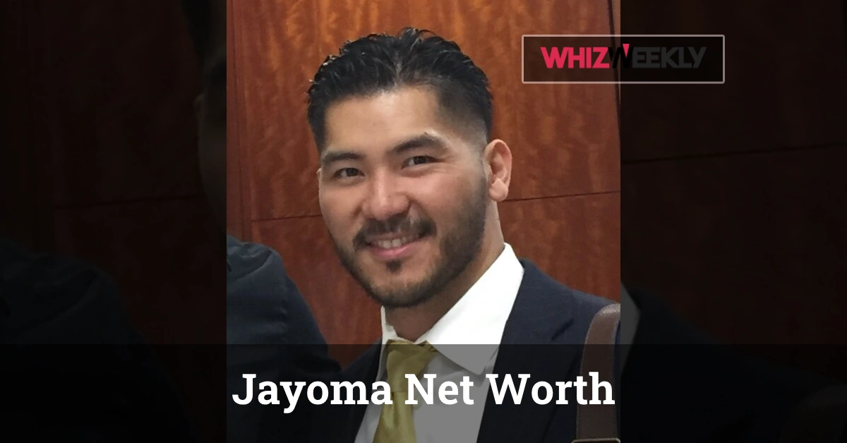 Jayoma Net Worth 2025 - Alain Jayoma in designer suit reviewing case files that contributed to his $600 million fortune.