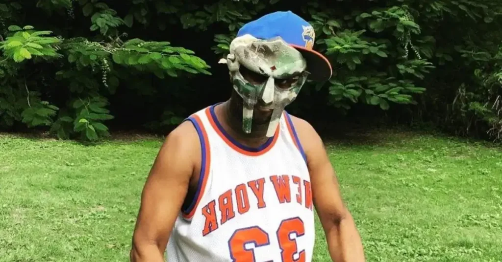 MF Doom net worth - masked rapper with metal face mask counting money