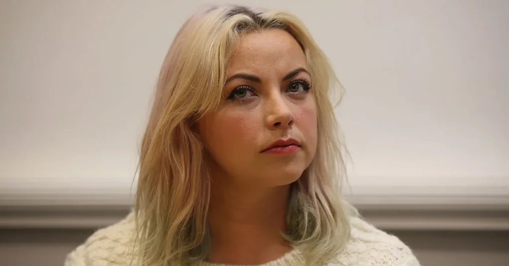 Charlotte Church smiling at an event, representing her success and the story behind Charlotte Church Net Worth.