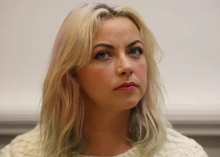 Charlotte Church smiling at an event, representing her success and the story behind Charlotte Church Net Worth.