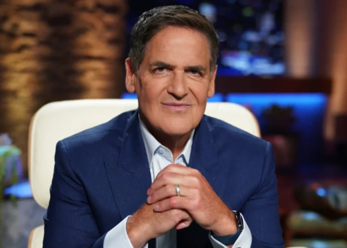 Cuban smiling on Shark Tank set, symbolizing Cuban Net Worth and his journey as a billionaire entrepreneur.