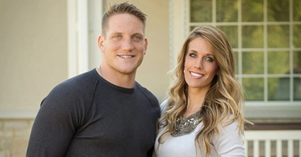 AJ Hawk standing with his wife outside their home, representing AJ Hawk Net Worth and his successful post-NFL lifestyle.