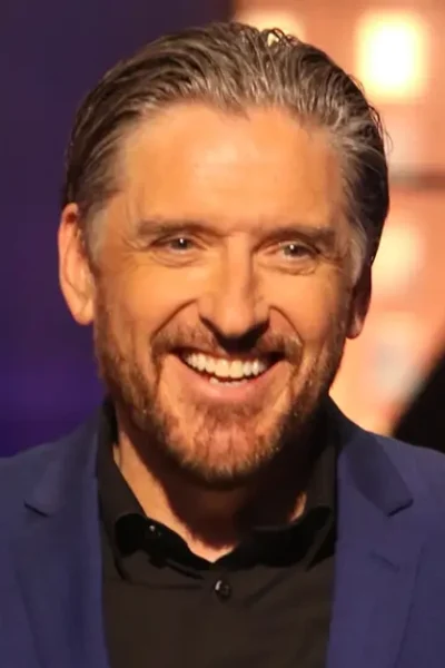 Craig Ferguson on set, smiling in a sharp blazer—capturing the charisma and legacy of the late-night icon in 2025.