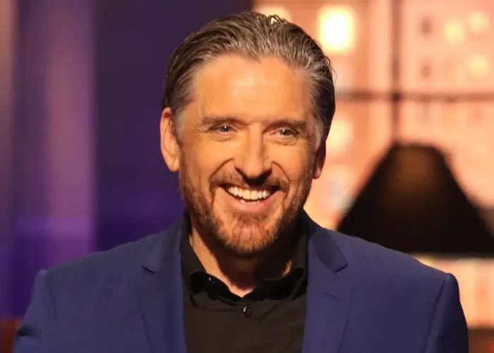 Craig Ferguson on set, smiling in a sharp blazer—capturing the charisma and legacy of the late-night icon in 2025.