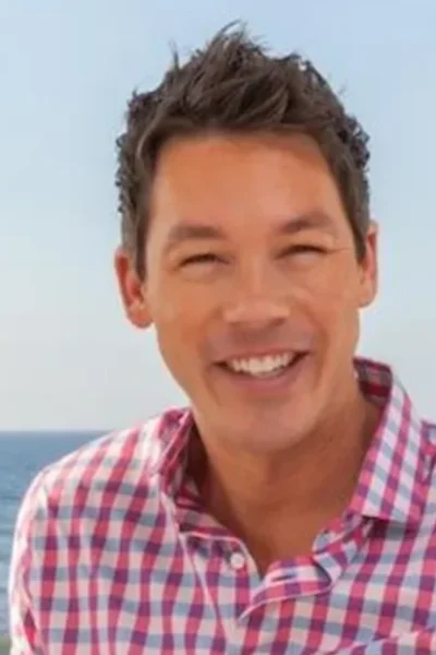 David Bromstad smiling at the beach showcasing his vibrant personality that matches his bold design philosophy and colorful aesthetic on HGTVRetryClaude can make mistakes. Please double-check responses.