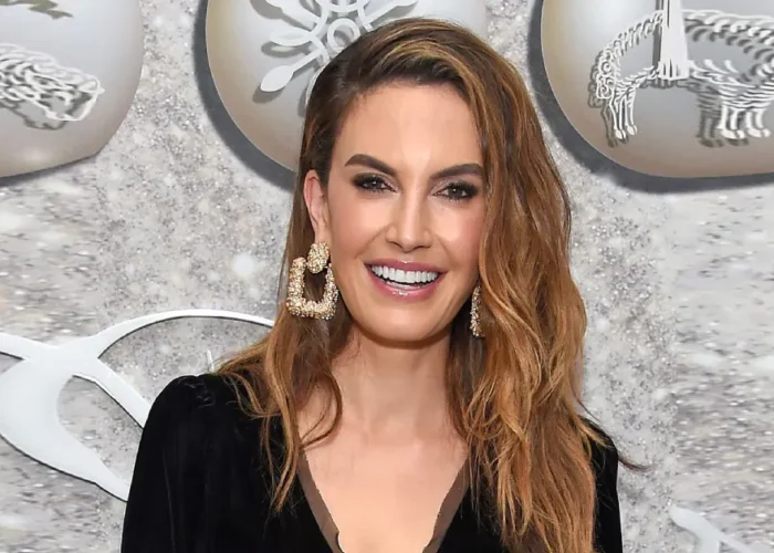 Elizabeth Chambers at a glamorous event in a black outfit and bold earrings, representing her success and Elizabeth Chambers Net Worth.