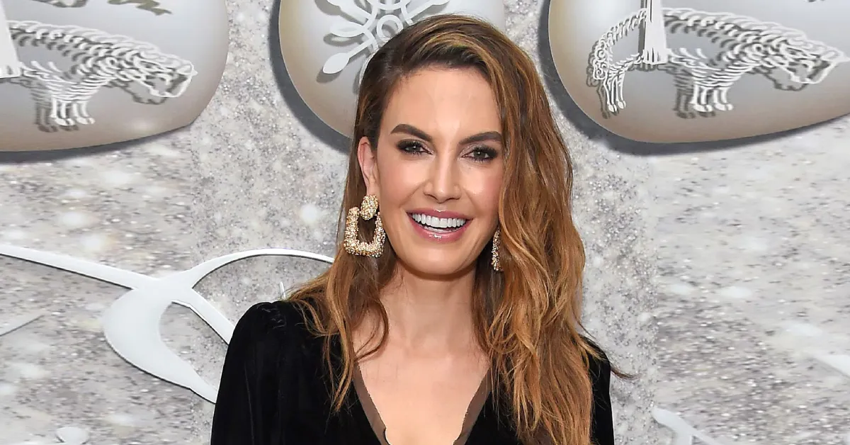 Elizabeth Chambers at a glamorous event in a black outfit and bold earrings, representing her success and Elizabeth Chambers Net Worth.