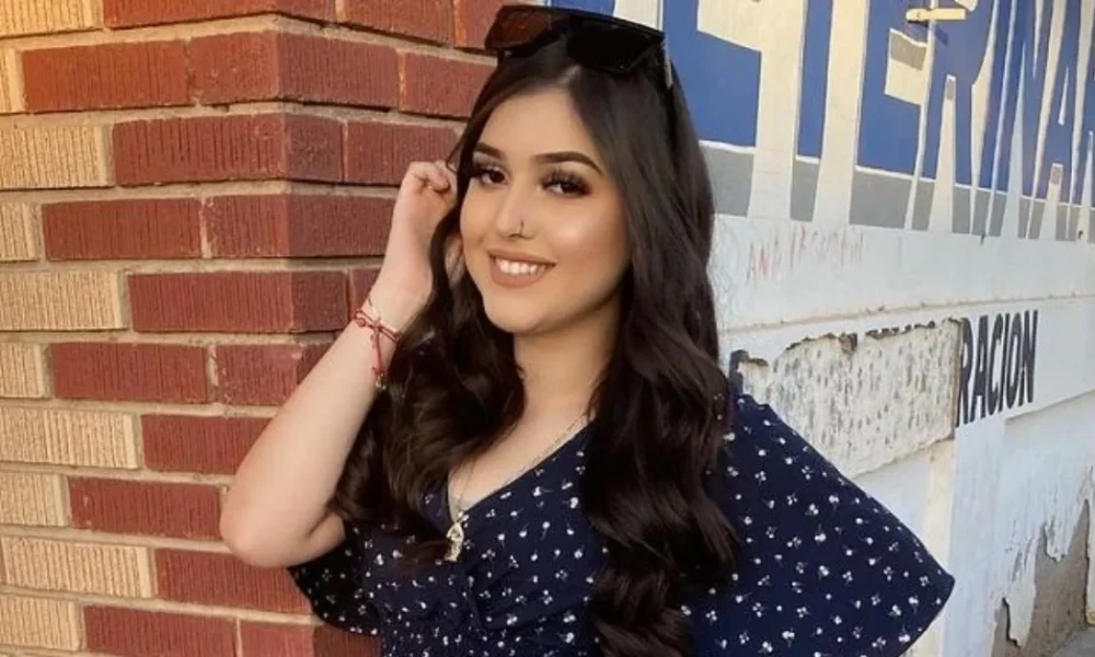 Melody Aguilar smiling confidently in a navy polka dot dress, showcasing the authentic personality that's made her a trusted social media influencer