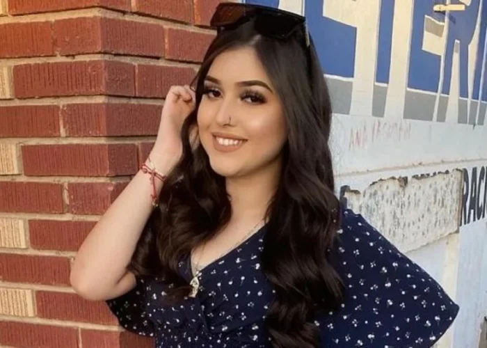 Melody Aguilar smiling confidently in a navy polka dot dress, showcasing the authentic personality that's made her a trusted social media influencer