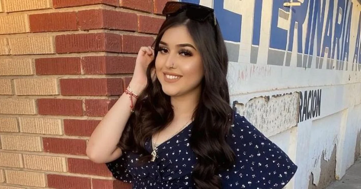 Melody Aguilar smiling confidently in a navy polka dot dress, showcasing the authentic personality that's made her a trusted social media influencer
