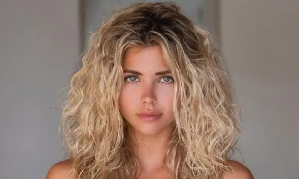 Nata Lee: Inside the Life of Instagram’s Most Popular Russian Model and DJ Nata Lee, Instagram's popular Russian model and DJ, with wavy blonde hair and striking blue eyes in a professional portrait