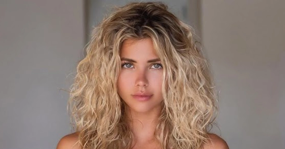 Nata Lee, Instagram's popular Russian model and DJ, with wavy blonde hair and striking blue eyes in a professional portrait