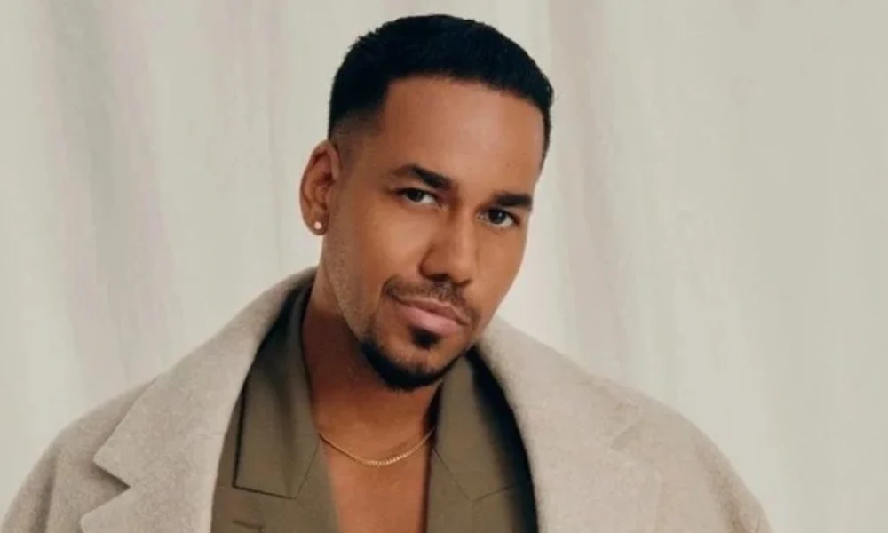 Romeo Santos featured in 2025 spotlight article, dressed stylishly and posing confidently during a public appearance.