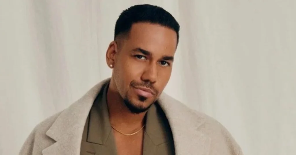 Romeo Santos featured in 2025 spotlight article, dressed stylishly and posing confidently during a public appearance.