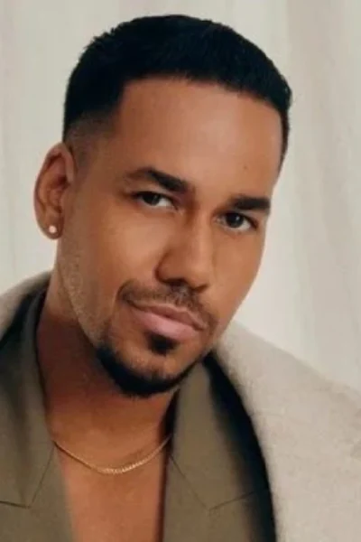 Romeo Santos featured in 2025 spotlight article, dressed stylishly and posing confidently during a public appearance.
