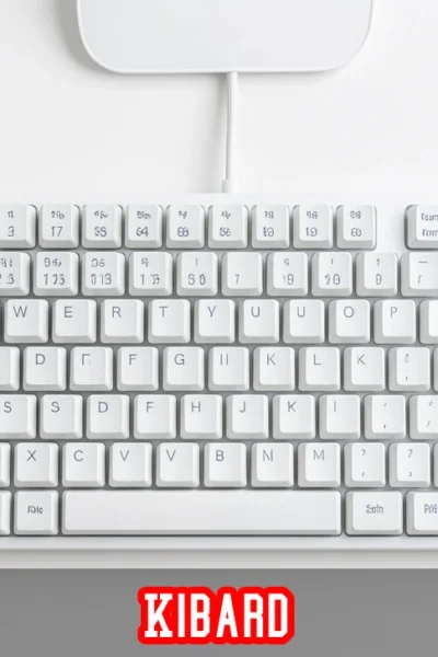 Kibard meaning explained with a close-up image of a mechanical keyboard on a minimalist white desk setup.